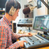 radio-host-using-sound-mixer-in-studio_13339-168792