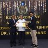 Dr. Ajay Bhamare receives award from EducationWorld editor Dilip Thakore & GrayQuest founder-CEO Rishab Mehta (right)