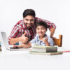 Indian,Kid,Studying,Online,,Attending,School,Via,E-learning,With,Father