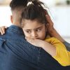 Closeup,Portrait,Of,Upset,Little,Girl,Hugging,Daddy,At,Home,