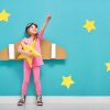 Little,Child,Girl,In,An,Astronaut,Costume,Is,Playing,And