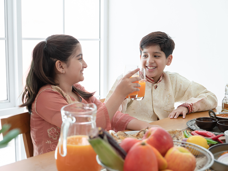 Happy,Indian,Family,Enjoy,Eating,Food,,Selective,Focus,On,Handsome