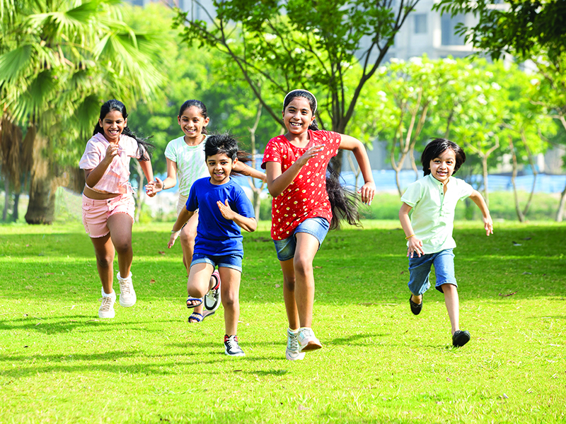 Group,Of,Happy,Playful,Indian,Children,Running,Outdoors,In,Spring