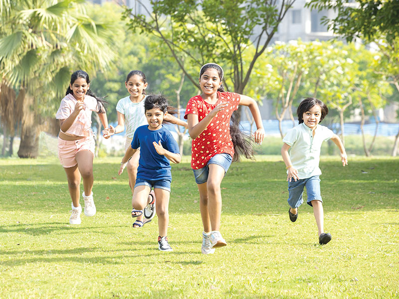 Group,Of,Happy,Playful,Indian,Children,Running,Outdoors,In,Spring