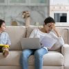 Tired,Young,Indian,Freelance,Mom,Working,From,Home,,Reading,Paper