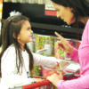 Girl,Having,Argument,With,Mother,At,Candy,Counter,In,Supermarket