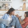 Confused,Teenage,Girl,Looking,At,Mother,Scolding,For,Using,Mobile