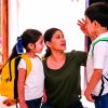 Beautiful,Loving,Latin,Mother,With,Her,Children,At,The,Door
