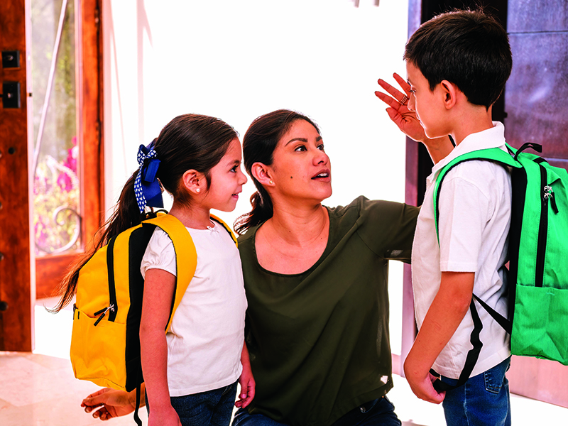 Beautiful,Loving,Latin,Mother,With,Her,Children,At,The,Door