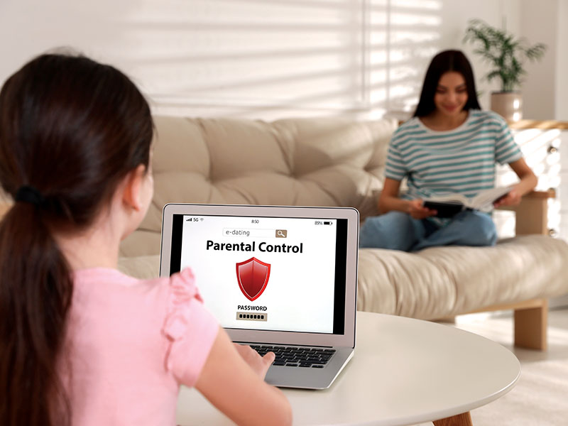 Little,Girl,Having,Access,Restriction,By,Parental,Control,On,Laptop