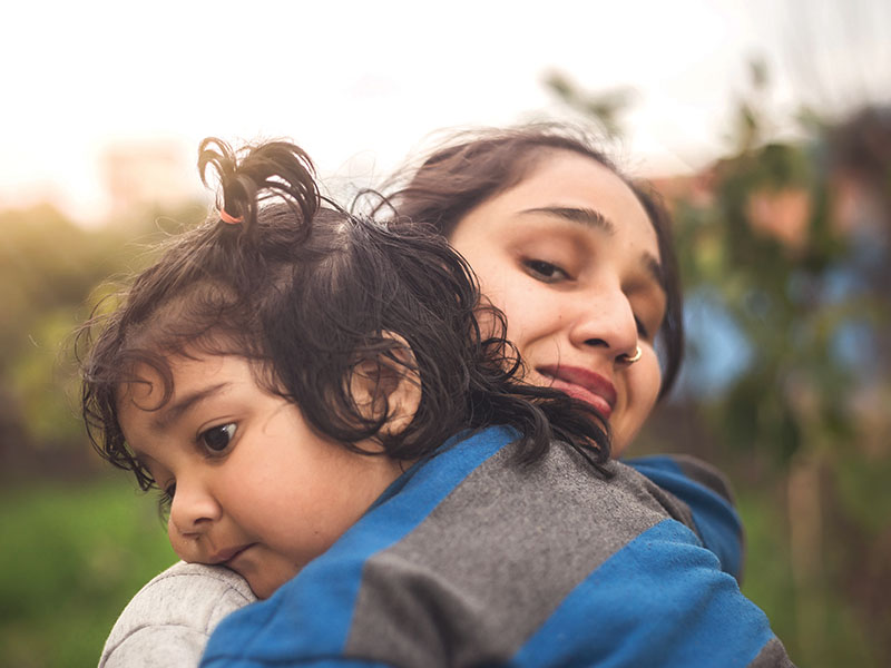 A,Sad,Indian,Daughter,Hugging,Mother,Outdoors.,Mom,With,Her
