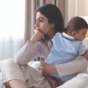 Woman,Suffering,From,Postpartum,Depression,With,Her,Little,Baby,On