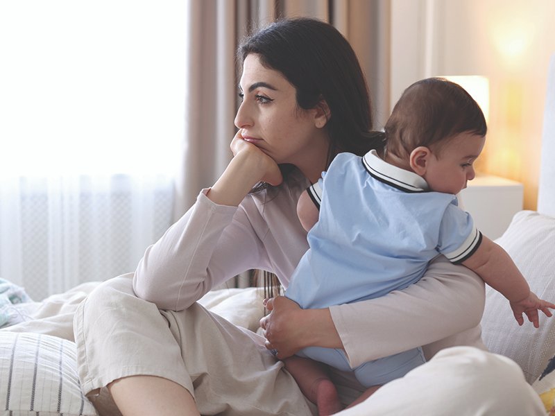 Woman,Suffering,From,Postpartum,Depression,With,Her,Little,Baby,On